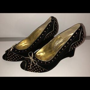 N.Y.L.A. black suede wedges with gold studs.